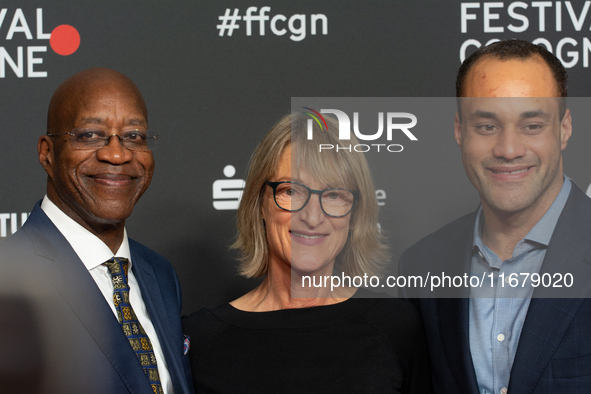 Edwin Moses, a former American hurdler, Anne Merrem, the mother of Julian Moses, and Julian Moses, the son of Edwin Moses, attend the screen...