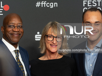 Edwin Moses, a former American hurdler, Anne Merrem, the mother of Julian Moses, and Julian Moses, the son of Edwin Moses, attend the screen...