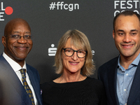 Edwin Moses, a former American hurdler, Anne Merrem, the mother of Julian Moses, and Julian Moses, the son of Edwin Moses, attend the screen...