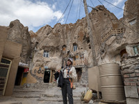 Iranian female blogger, Zahra Heidarpanah, known as Zarichii, sings an Iranian folklore song while visiting the Kandovan cliff village, 650...