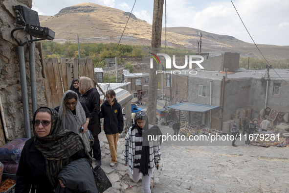 Iranian women visit the Kandovan cliff village, 650 km (400 miles) northwest of Tehran, Iran, on October 18, 2024. Kandovan is a village whe...