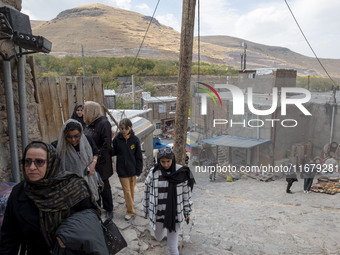 Iranian women visit the Kandovan cliff village, 650 km (400 miles) northwest of Tehran, Iran, on October 18, 2024. Kandovan is a village whe...