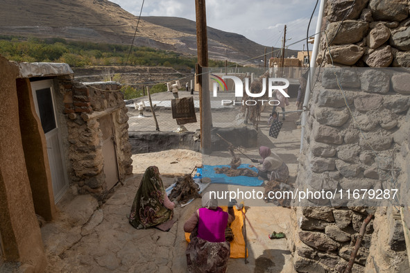 Villagers work with wool in Kandovan cliff village, 650 km (400 miles) northwest of Tehran, Iran, on October 18, 2024. Kandovan is a village...