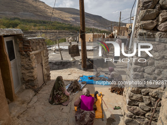 Villagers work with wool in Kandovan cliff village, 650 km (400 miles) northwest of Tehran, Iran, on October 18, 2024. Kandovan is a village...