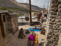 Villagers work with wool in Kandovan cliff village, 650 km (400 miles) northwest of Tehran, Iran, on October 18, 2024. Kandovan is a village...