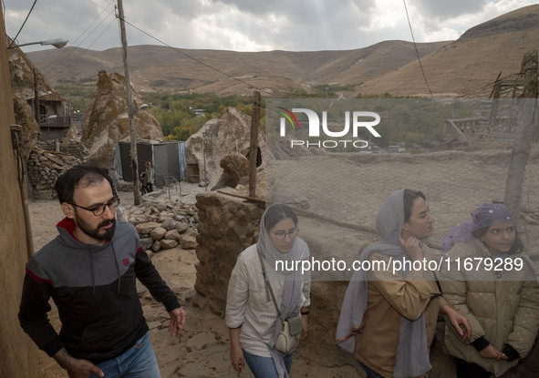 Iranian youths visit the Kandovan cliff village, 650 km (400 miles) northwest of Tehran, Iran, on October 18, 2024. Kandovan is a village wh...