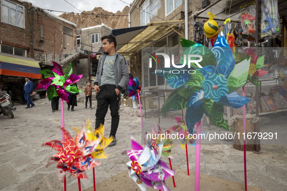 Pinwheels are placed on a sidewalk in Kandovan cliff village, 650 km (400 miles) northwest of Tehran, Iran, on October 18, 2024. Kandovan is...