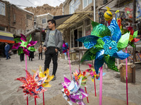 Pinwheels are placed on a sidewalk in Kandovan cliff village, 650 km (400 miles) northwest of Tehran, Iran, on October 18, 2024. Kandovan is...