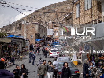 Iranian people visit the Kandovan cliff village, 650 km (400 miles) northwest of Tehran, Iran, on October 18, 2024. Kandovan is a village wh...