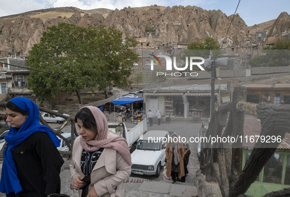 Iranian women visit the Kandovan cliff village, located 650 km (400 miles) northwest of Tehran, Iran, on October 18, 2024. Kandovan is a vil...