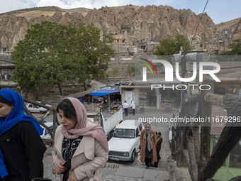 Iranian women visit the Kandovan cliff village, located 650 km (400 miles) northwest of Tehran, Iran, on October 18, 2024. Kandovan is a vil...