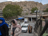 Iranian women visit the Kandovan cliff village, located 650 km (400 miles) northwest of Tehran, Iran, on October 18, 2024. Kandovan is a vil...