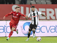 Alexandru Pop and Radu Boboc play during the Universitatea Cluj vs. Otelul Galati match at Cluj Arena in Cluj, Romania, on October 18, 2024....