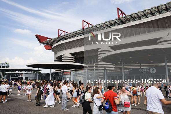 The audience attends Taylor Swift's The Eras Tour concert outside the Stadio San Siro in Milan, Italy, on July 13, 2024. 