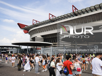 The audience attends Taylor Swift's The Eras Tour concert outside the Stadio San Siro in Milan, Italy, on July 13, 2024. (