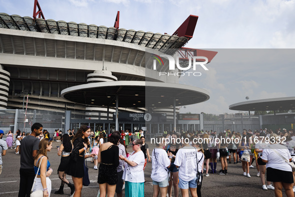 The audience attends Taylor Swift's The Eras Tour concert outside the Stadio San Siro in Milan, Italy, on July 13, 2024. 