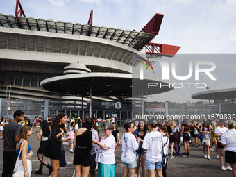 The audience attends Taylor Swift's The Eras Tour concert outside the Stadio San Siro in Milan, Italy, on July 13, 2024. (