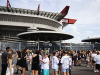 The audience attends Taylor Swift's The Eras Tour concert outside the Stadio San Siro in Milan, Italy, on July 13, 2024. (