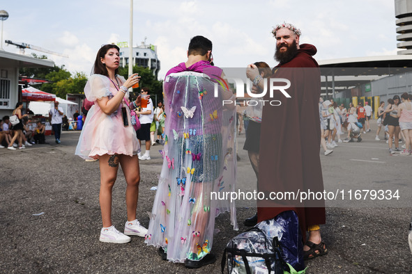 The audience attends Taylor Swift's The Eras Tour concert outside the Stadio San Siro in Milan, Italy, on July 13, 2024. 