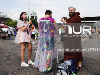 The audience attends Taylor Swift's The Eras Tour concert outside the Stadio San Siro in Milan, Italy, on July 13, 2024. (