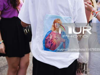 The audience attends Taylor Swift's The Eras Tour concert outside the Stadio San Siro in Milan, Italy, on July 13, 2024. (