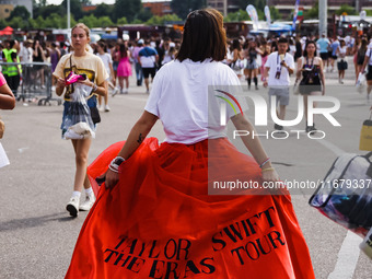 The audience attends Taylor Swift's The Eras Tour concert outside the Stadio San Siro in Milan, Italy, on July 13, 2024. (