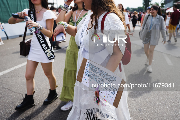 The audience attends Taylor Swift's The Eras Tour concert outside the Stadio San Siro in Milan, Italy, on July 13, 2024. 