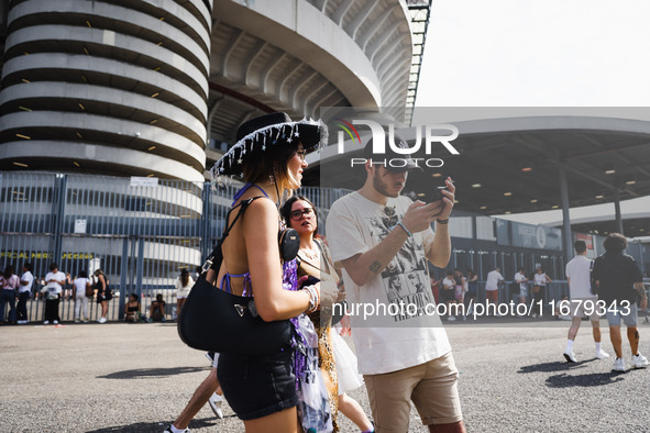 The audience attends Taylor Swift's The Eras Tour concert outside the Stadio San Siro in Milan, Italy, on July 13, 2024. 