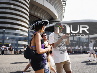 The audience attends Taylor Swift's The Eras Tour concert outside the Stadio San Siro in Milan, Italy, on July 13, 2024. (