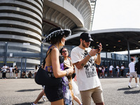 The audience attends Taylor Swift's The Eras Tour concert outside the Stadio San Siro in Milan, Italy, on July 13, 2024. (