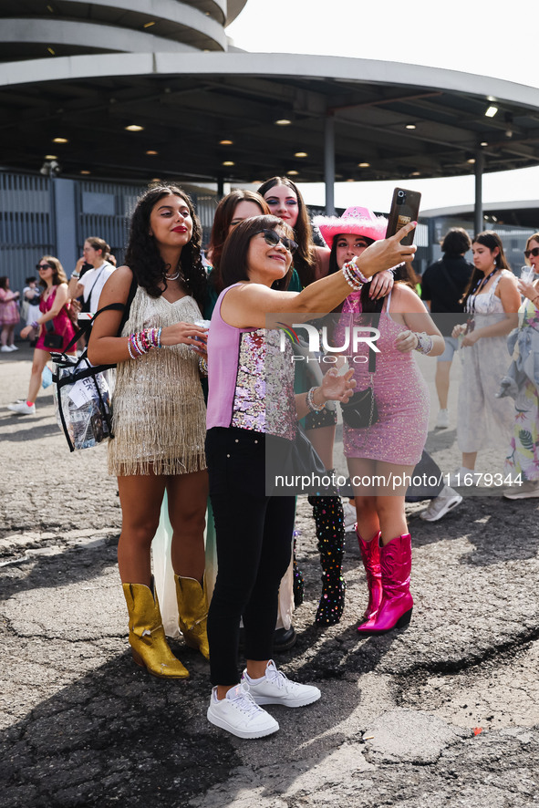 The audience attends Taylor Swift's The Eras Tour concert outside the Stadio San Siro in Milan, Italy, on July 13, 2024. 