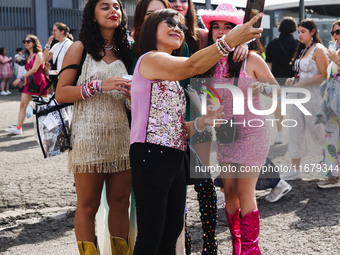 The audience attends Taylor Swift's The Eras Tour concert outside the Stadio San Siro in Milan, Italy, on July 13, 2024. (