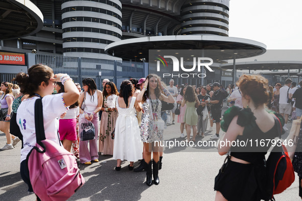 The audience attends Taylor Swift's The Eras Tour concert outside the Stadio San Siro in Milan, Italy, on July 13, 2024. 