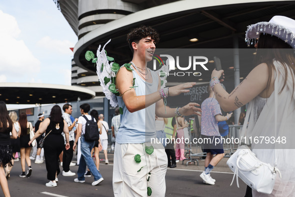 The audience attends Taylor Swift's The Eras Tour concert outside the Stadio San Siro in Milan, Italy, on July 13, 2024. 