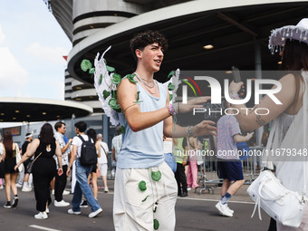 The audience attends Taylor Swift's The Eras Tour concert outside the Stadio San Siro in Milan, Italy, on July 13, 2024. (