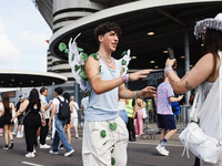 The audience attends Taylor Swift's The Eras Tour concert outside the Stadio San Siro in Milan, Italy, on July 13, 2024. (