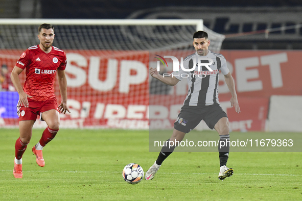 Iulian Cristea is in action during Universitatea Cluj v Otelul Galati at Cluj Arena in Cluj, Romania, on October 18, 2024 