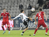 Axeanadru Bota is in action during the Universitatea Cluj vs. Otelul Galati match at Cluj Arena in Cluj, Romania, on October 18, 2024 (