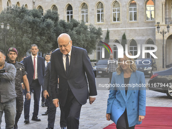 Lebanese Prime Minister Najib Mikati welcomes his Italian counterpart Giorgia Meloni ahead of their meeting at the Beirut governmental palac...