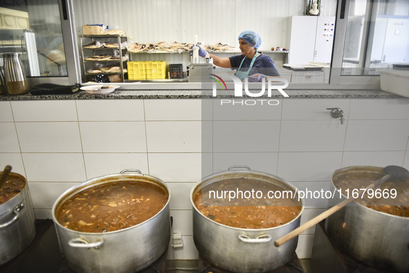 Lebanese volunteers prepare food portions for displaced people at Father Hani Tawk's charitable facility, Mariam's Kitchen, in Beirut, Leban...