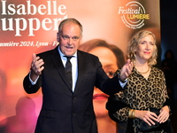 Christian Carion and a woman at the light festival award ceremony in Lyon, France, on October 19, 2024. (