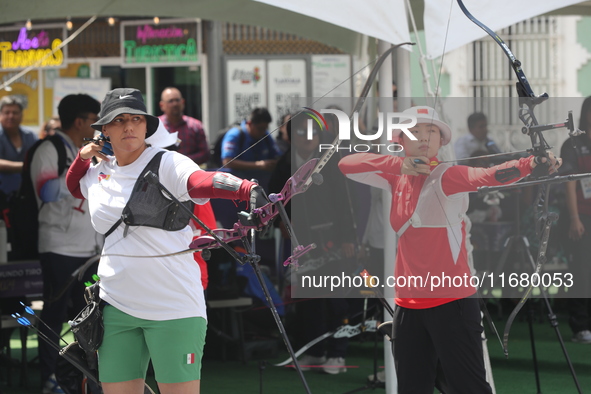 Alejandra Valencia of Mexico and Yang Xialoei of China participate in the practice session before the competition on the first day of the Tl...