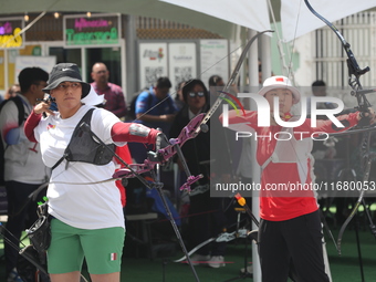 Alejandra Valencia of Mexico and Yang Xialoei of China participate in the practice session before the competition on the first day of the Tl...