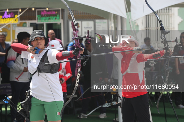 Alejandra Valencia of Mexico and Yang Xialoei of China participate in the practice session before the competition on the first day of the Tl...