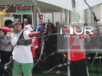 Alejandra Valencia of Mexico and Yang Xialoei of China participate in the practice session before the competition on the first day of the Tl...