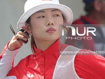 Yang Xialoei of China participates in the practice session before the competition against Alejandra Valencia of Mexico (not in picture) on t...