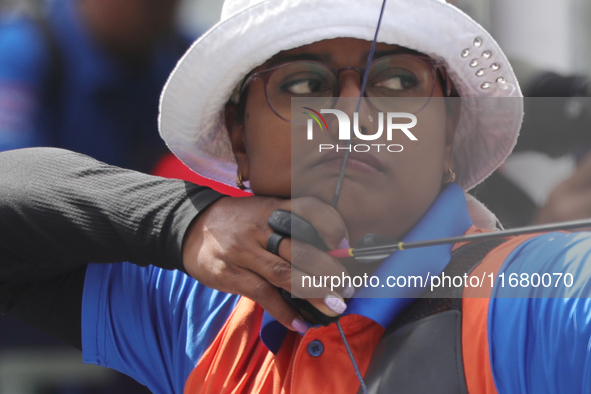 Deepika Kumari of India participates in the practice session before the competition against Li Jiaman of China (not in picture) on the first...