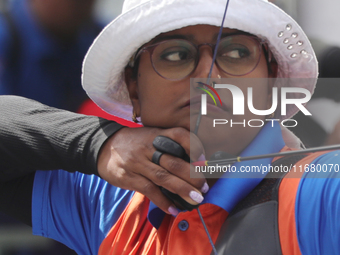 Deepika Kumari of India participates in the practice session before the competition against Li Jiaman of China (not in picture) on the first...