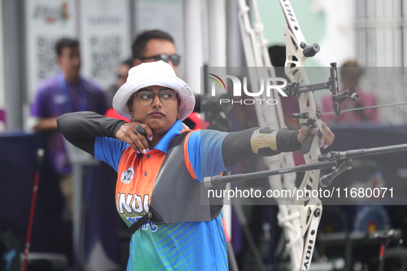 Deepika Kumari of India participates in the practice session before the competition against Li Jiaman of China (not in picture) on the first...