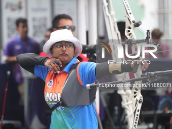 Deepika Kumari of India participates in the practice session before the competition against Li Jiaman of China (not in picture) on the first...